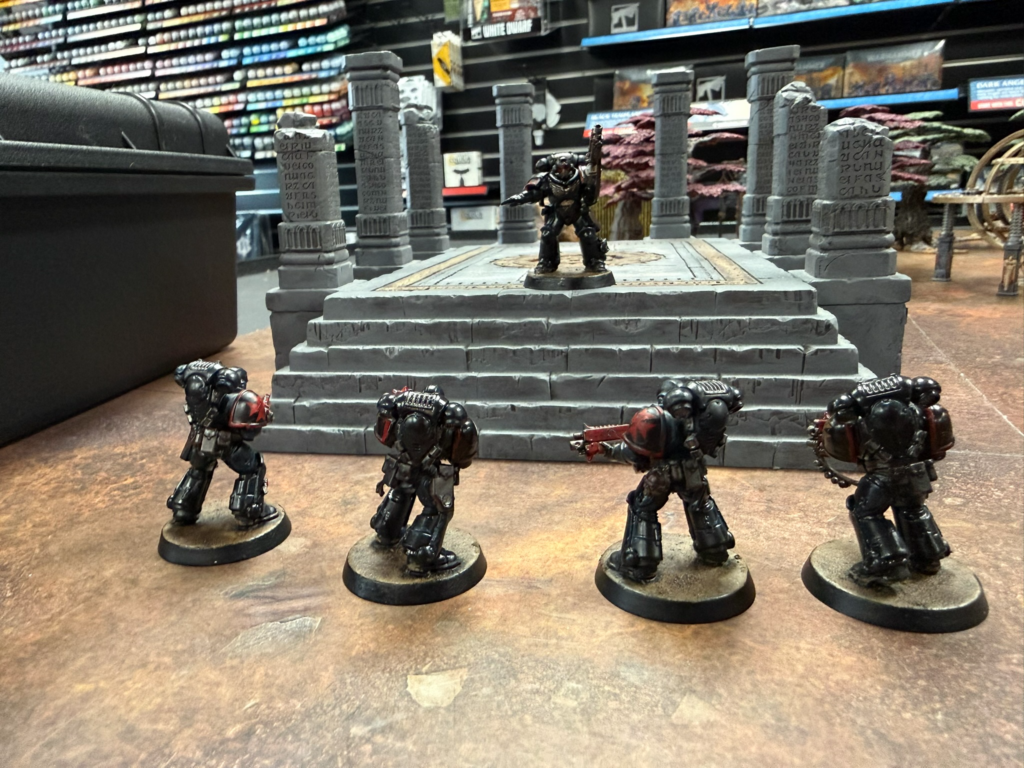 Black Templars in front of a set of ruins